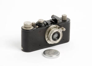 LEITZ: Leica Standard (black) camera, 1936 [#210558], with Elmar f3.5 50mm lens and metal lens cap. In maker's leather ERC.