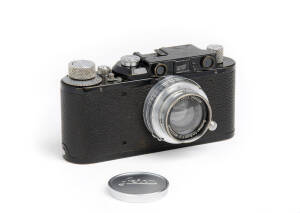 LEITZ: Leica II (D) black body camera 1937 [#220355], with coupled rangefinder and Summar f2 50mm lens and lens cap; with owner's name engraved on base plate.