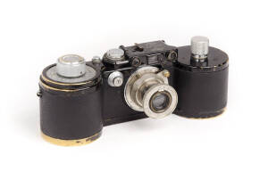 LEITZ: Leica 250 Reporter (GG) 35mm Rangefinder camera [#353614], 1942-43, with Elmar f3.5 50mm lens, both film magazines and shutter speed to 1000. [NB: reported public auction sales world-wide since Nov. 2011: 9, for prices between US$5508 and $259,200.