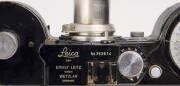 LEITZ: Leica 250 Reporter (GG) 35mm Rangefinder camera [#353614], 1942-43, with Elmar f3.5 50mm lens, both film magazines and shutter speed to 1000. [NB: reported public auction sales world-wide since Nov. 2011: 9, for prices between US$5508 and $259,200. - 2