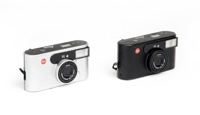LEITZ: Leica C1 cameras in black and silver bodies, both with Vario-Elmar 38-105mm ASPH lenses. (2 cameras).