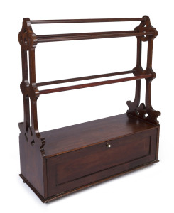 A Colonial newspaper rack with cabinet base and steel caster, Australian cedar, circa 1880. Part of the original furnishings from RUPERTSWOOD in Victoria. 98cm high, 83cm wide, 33cm deep