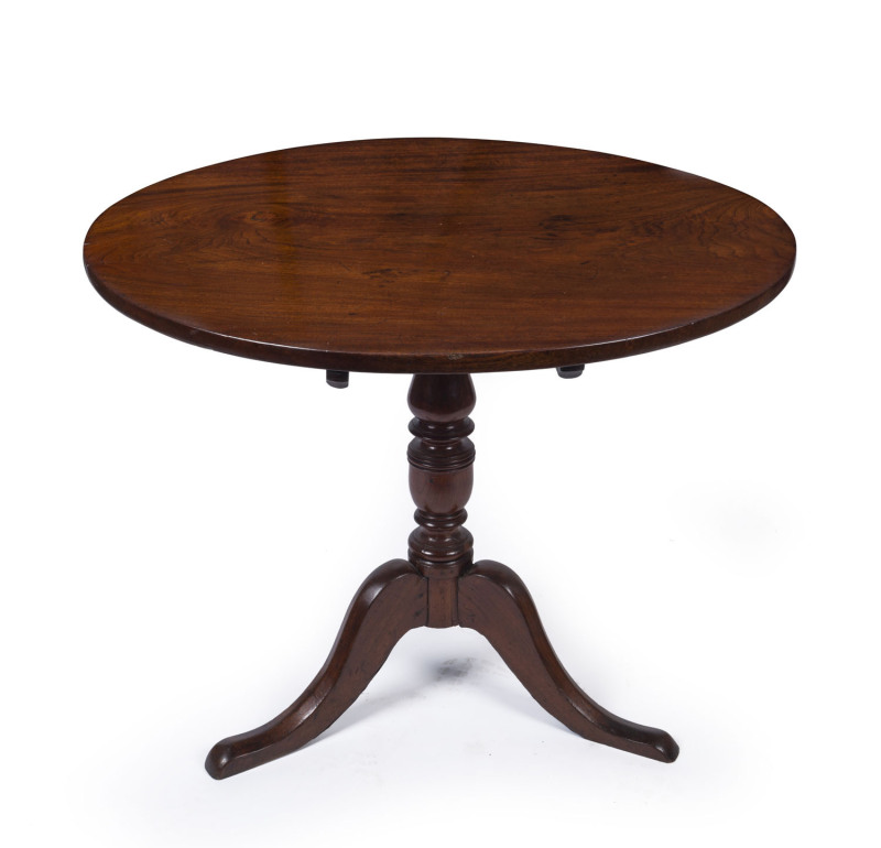 A rare Colonial cedar tilt-top supper table with baluster and ring turned pedestal terminating in three outswept sabre legs, ​Sydney origin, circa 1820, 76cm high, 92cm diameter