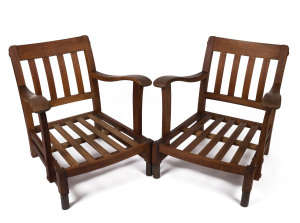 A pair of Australian Arts and Crafts splat back armchairs, Queensland silky oak, circa 1925, 73cm across the arms