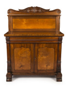 A fine cedar and birdseye huon pine two door chiffonier with Thomas Hope scroll back with single shelf, the base with single ogee moulded fitted cutlery drawer above finely figured huon pine shield panel doors, Tasmanian origin, circa 1845, 148cm high, 11