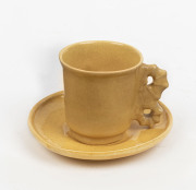 KLYTIE PATE coffee cup and saucer with seahorse handle, incised "Klytie Pate", the saucer 10cm diameter