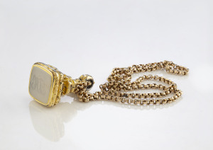An early Victorian seal on 9ct yellow gold chain, the chain 6.3 grams