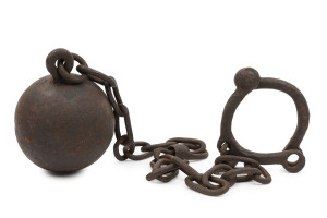 A convict ball and chain with riveted leg shackles, early 19th century, ​108cm long, ball diameter 12cm