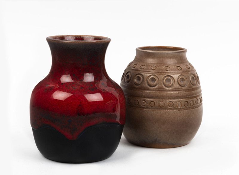 ERIC JUCKERT red glazed retro pottery vase together with a brown glazed vase with circular motif, both incised "Eric Juckert", ​14cm and 12cm high