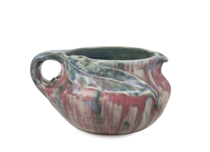 PHILIPPA JAMES pottery jug with applied gumnut and leaf, glazed in pink and blue with green highlights, incised "Philippa James", ​9cm high, 17cm wide