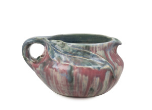 PHILIPPA JAMES pottery jug with applied gumnut and leaf, glazed in pink and blue with green highlights, incised "Philippa James", 9cm high, 17cm wide