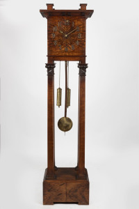 A stunning Australian Arts & Crafts grandfather clock, solid blackwood with carved gumnuts, leaves and oyster blackwood veneer dial and base, early 20th century, 191cm high, 48cm wide, 37cm deep