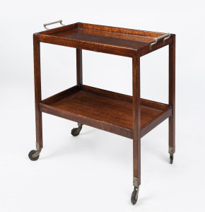 An Australian Art Deco drinks trolley, mountain ash with nickel plate handles and fitted glass top, circa 1920. Note: Near identical example by Harry Goldman resides in the Gary & Genevieve Morgan Collection, Melbourne. 89cm high, 84cm wide, 47cm deep