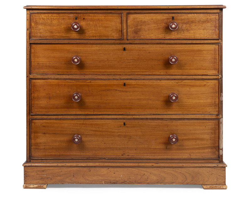 An early Colonial Australian chest of five drawers, cedar with string inlay and beefwood cockbeading, New South Wales origin, circa 1830, later South Australian knobs, missing feet, 105cm high, 113cm wide, 54cm deep