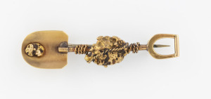 A gold miner's brooch, shovel form with large gold specimen entwined in rope, 19th century, 5cm wide, 4.9 grams
