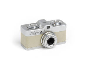 MEOPTA: Mikroma II, 1959 sub-miniature camera [#26505] with Mirar f3.5 20mm lens; body in scarce beige leather covering.