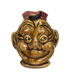 Ceramic character jug, early 20th century, 12cm high