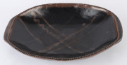 HAROLD HUGHAN studio pottery fruit bowl with brown and black glaze, signed "Hughan" with Glen Iris monogram, 38cm wide