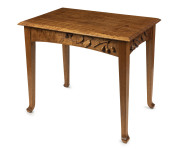 ROBERT PRENZEL centre table, Queensland maple with carved gumnuts, leaves, blossoms and branches on four sides, early 20th century, 74cm high, 92cm wide, 58cm deep