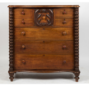 An Australian cedar seven drawer chest with carved hat drawer and bobbin turned columns, 19th century, 122cm high, 116cm wide, 53cm deep