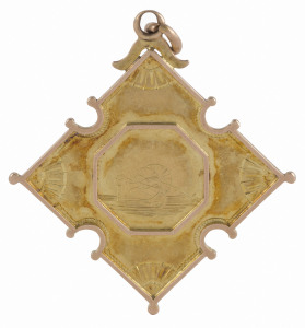 FIRE BRIGADE: 15ct gold fob (6.7gms) depicting a two-wheeled hose cart on the front; verso engraved "CLUNES FETE 1887 * Hose Practice 8 Men : FIRST PRIZE Won by W.J. Hawkes".