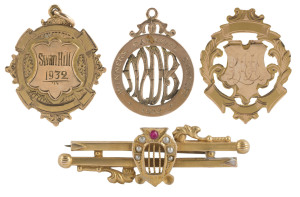 MUSIC AWARDS, ETC: a 9ct gold fob (6.7gms) engraved "Winners Carnival Contest 1922 L.Heaps"; a 9ct gold fob (8.3gms) engraved "Swan Hill 1932" and verso "SWAN HILL BAND CONTEST Pres. by CR. H. PYE, J.P. to LES HEAPS Winning Band Master". Also, a 15ct gold award (3.5gms) engraved verso "SWAN HILL HOSPITAL FETE D Grade Contest 1933 : Selection Waltz won BY SUNRAYSIA BAND Conductor L.A. HEAP"; and a 9ct gold brooch (3.4gms) featuring a lyre decorated with 6 pearls and a ruby. (4 items).