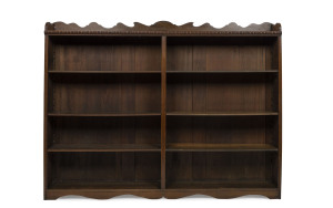 An Australian library bookcase with adjustable shelves, stained kauri pine early 20th century, ​163cm high, 210cm wide, 30cm deep