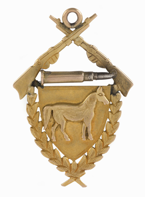 AUSTRALIAN LIGHT HORSE: 15ct gold award fob (6.75gms) depicting crossed rifles and a bullet over a horse on a shield surrounded by laurel leaves, engraved verso "Best Turned Out Member Squadron A.L.H. Presented By Sub. Insp. CARROWAY to J. ADRIAN 1909".