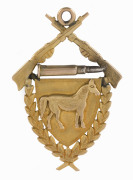 AUSTRALIAN LIGHT HORSE: 15ct gold award fob (6.75gms) depicting crossed rifles and a bullet over a horse on a shield surrounded by laurel leaves, engraved verso "Best Turned Out Member Squadron A.L.H. Presented By Sub. Insp. CARROWAY to J. ADRIAN 1909".