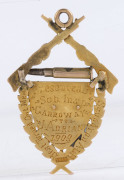 AUSTRALIAN LIGHT HORSE: 15ct gold award fob (6.75gms) depicting crossed rifles and a bullet over a horse on a shield surrounded by laurel leaves, engraved verso "Best Turned Out Member Squadron A.L.H. Presented By Sub. Insp. CARROWAY to J. ADRIAN 1909". - 2