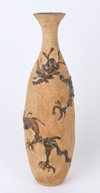 A tall studio pottery vase with dragon decoration, impressed monogram mark to base, ​56cm high