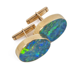 A pair of 9ct gold and opal oval-shaped cufflinks, (2).