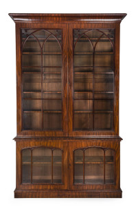 LENEHAN (attributed) superb Colonial library bookcase, full cedar construction and veneer in fine cuts of figured cedar with Lenehan's typical moulded pediment and cross banded plinth, Sydney origin, circa 1850. 273cm high, 175cm wide, 42cm deep