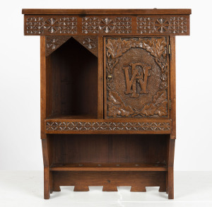 An antique wall hanging pipe rack, chip-carved with monogram, late 19th century, 59cm high, 50cm wide, 15cm deep