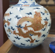 An antique Chinese porcelain vase decorated with five iron red and gold celestial dragons on underglaze blue and white ground, Guangxu period, Qing Dynasty, late 19th century early 20th century, Qianlong underglaze blue six character mark to base, 38cm hi - 4