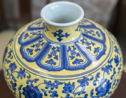 A Chinese Meiping porcelain vase, yellow overlay with underglaze blue decoration of lotus flowers, made in two parts luted at lower end of the neck, 19th/20th century. Note the yellow has continuous pitting to the glaze. Qianlong underglaze seal script ma - 5