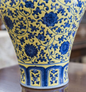 A Chinese Meiping porcelain vase, yellow overlay with underglaze blue decoration of lotus flowers, made in two parts luted at lower end of the neck, 19th/20th century. Note the yellow has continuous pitting to the glaze. Qianlong underglaze seal script ma - 6