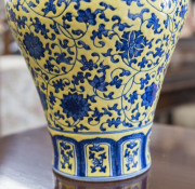 A Chinese Meiping porcelain vase, yellow overlay with underglaze blue decoration of lotus flowers, made in two parts luted at lower end of the neck, 19th/20th century. Note the yellow has continuous pitting to the glaze. Qianlong underglaze seal script ma - 8