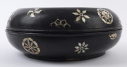 An 18th century Chinese Ryukyuan black lacquered covered bowl with mother of pearl inlay adorned with gilded Shou good luck symbol incorporating two Wan symbols, 15cm high, 39cm diameter. Note: A near identical example was auctioned at Sotheby's, London, - 2