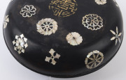 An 18th century Chinese Ryukyuan black lacquered covered bowl with mother of pearl inlay adorned with gilded Shou good luck symbol incorporating two Wan symbols, 15cm high, 39cm diameter. Note: A near identical example was auctioned at Sotheby's, London, - 3