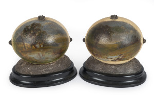 J.M. WENDT A fine pair of Australian silver mounted ostrich eggs, each egg decorated with a finely painted Australian bush scene (unsigned); on silver bases. Signed J.M. Wendt, with lion passant and queen's head. Both 18cm high, 19cm wide. Provenance: Toby & Juliana Hooper, October 1988.