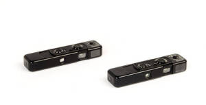 MINOX (Germany): Minox B sub-miniature cameras in black, 1964 [#816091-B] & 1967 [#910272 - metric]. Both with original plastic boxes, owner's manuals and other papers.