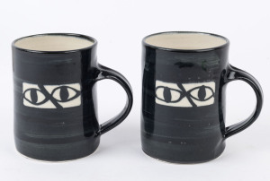 SIDNEY NOLAN "Ned Kelly" two pottery mugs, signed "Nolan at Heide 1946-47, Dobell 1997" 6/50 and 7/50, 10.5cm high
