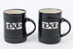 SIDNEY NOLAN "Ned Kelly" two pottery mugs, signed "Nolan at Heide 1946-47, Dobell 1997" 6/50 and 7/50, ​10.5cm high