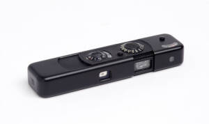 MINOX (Germany): Minox BL sub-miniature camera in black, 1972-73, [#1216882] together with black flash attachment in leather case.