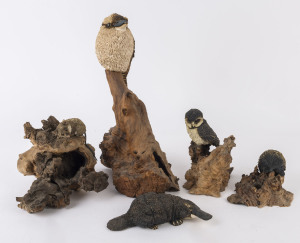 Five Australian ceramic animal ornaments mounted on mallee root, 20th century, the largest 41cm high
