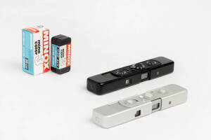 MINOX (Germany): Minox C sub-miniature cameras, 1970-71, [#2343457 - chrome] & [#2374758 - black]; both metric and in leather cases with chains. (2 cameras). Accompanied by 4 unopened film cassettes.