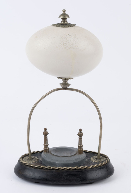 An antique pocket watch stand, polished emu egg with silver plated mounts on wooden base, 19th century, 30cm high