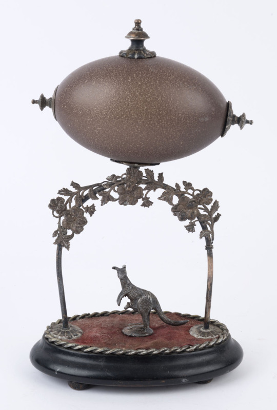 An antique Australiana emu egg centrepiece display, silver plated mounts adorned with kangaroo on ebonized plinth, 19th century,29cm high