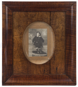 An antique Australian picture frame, fiddleback blackwood with Queensland maple slip and child portrait photograph, circa 1900, 38 x 33cm overall